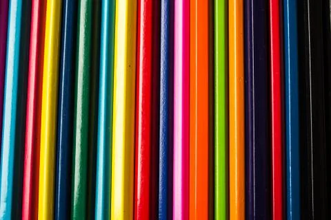 Row of colored pencils folded Stock Photos