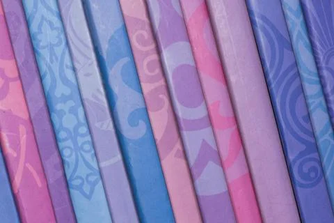 A row of colorful books with different patterns Stock Photos