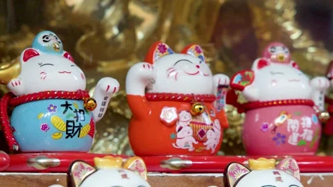 Row of Colorful Ceramic Maneki Neko Lucky Cat Figurines in Manila Stock Footage 329457791