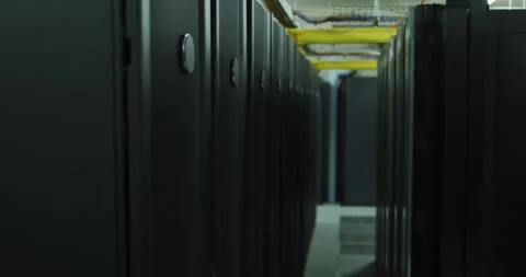 Row of computer servers and corridor in tech room Stockbeeldmateriaal 337096021