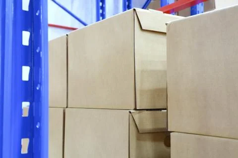 Row of cotton boxes kept in warehouse shelves ; Stock Photos