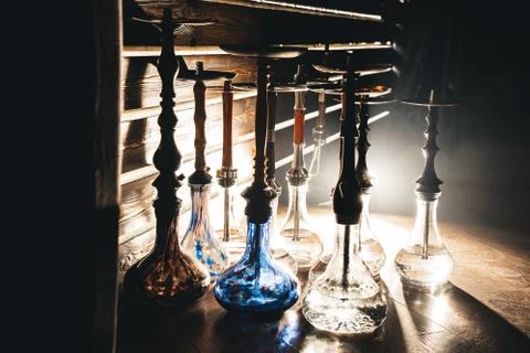 Row of different hookahs in a staff-room in a dramatic light Stock-Fotos