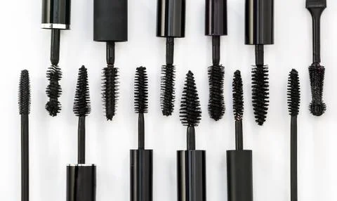 Row of different mascara brushes on a white background Stock Photos