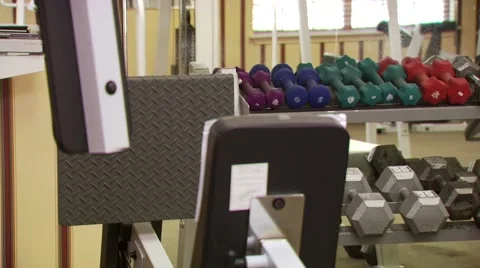 Row of dumbbells on rack in gym Stock Footage 54592862