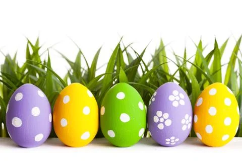 Row of Easter eggs on grass Stock Photos