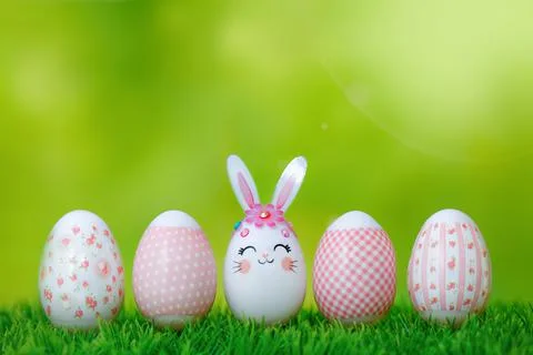 A row of Easter eggs on the grass. Stock Photos