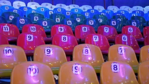 A row of empty chairs in a circus or at a show with flashing lights. Stock Footage 309085072