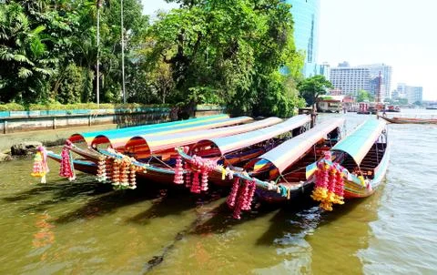 Row of Empty Colorful Long Tail Boats in Thailand Stock Photos