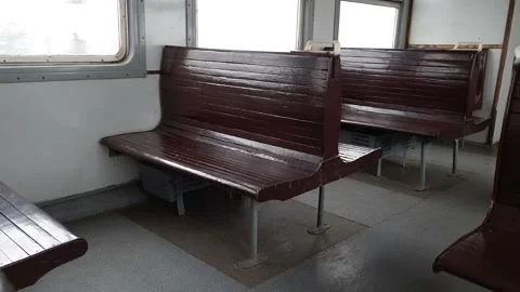 Row of empty old wooden brown seats in a driving retro train. Stock-Footage 147267838