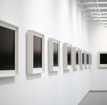 Row of empty picture frames on a wall of an art gallery Stock Photos