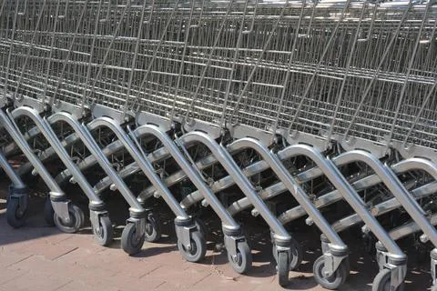 Row of empty shopping carts outside a store Stock Photos