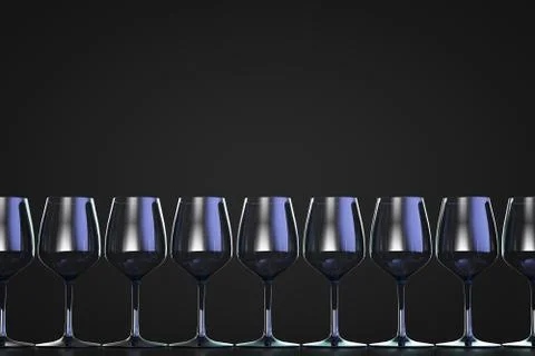 A row of empty wine glasses. Dark background. Copy space. Stock Photos