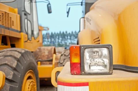 Row of excavators Stock Photos