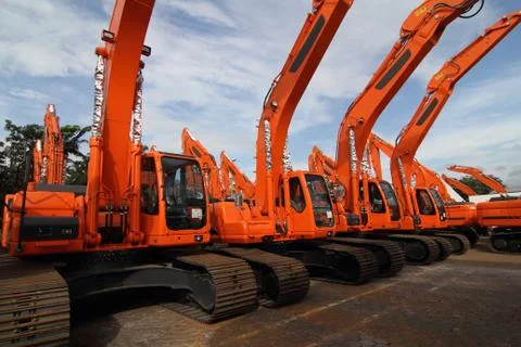 A row of excavators Stock Photos
