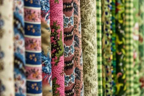Row of fabrics with different patterns and colors Stock Photos