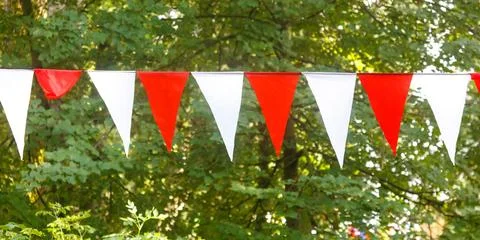 Row of flags with red and white stripes 库存照片