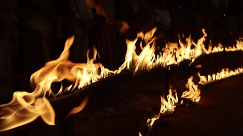 Row of flames at night Stock Footage 324517544