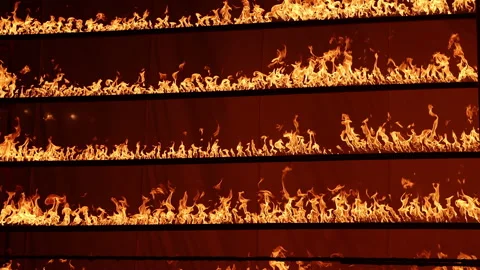 Row of flames at night Stock Footage 324520304