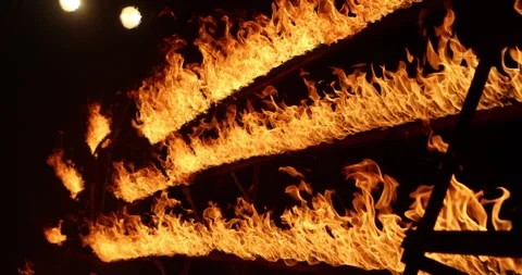 Row of flames at night Stock Footage 324521554