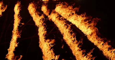 Row of flames at night Stock Footage 324521598