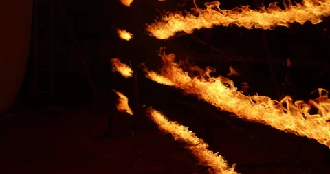 Row of flames at night Stock Footage 324521777