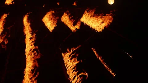 Row of flames at night Stock Footage 324521885
