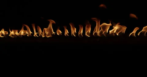 Row of flames at night Stock Footage 324523050