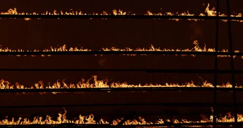 Row of flames at night Stock Footage 324523865