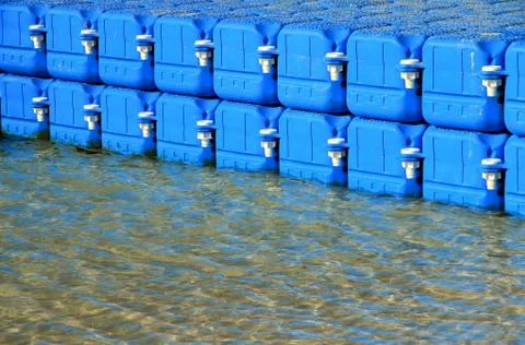 Row of floating bridge with water reflection at Koh Larn island,Pattaya, Ch.. Stock Photos