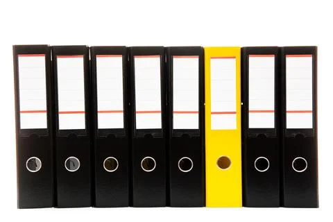 Row of folders for papers and documentation on a shelf in the office Stock Photos