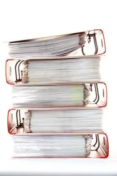 Row of folders for papers and documentation on a shelf in the office 스톡 사진