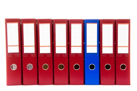 Row of folders for papers and documentation on a shelf in the office Stock Photos