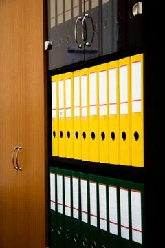 Row of folders for papers and documentation on a shelf in the office 写真素材