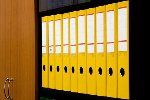 Row of folders for papers and documentation on a shelf in the office 写真素材