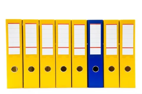 Row of folders for papers and documentation on a shelf in the office Stock Photos