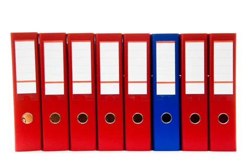Row of folders for papers and documentation on a shelf in the office Stock Photos