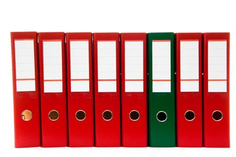 Row of folders for papers and documentation on a shelf in the office Stock Photos