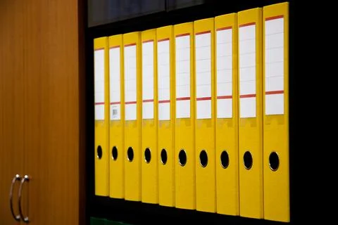 Row of folders for papers and documentation on a shelf in the office 写真素材
