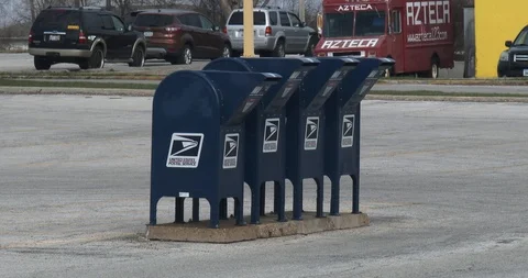 Row of Four Mailboxes in Parking Lot Stock-Footage 88840212