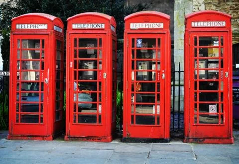 Row of Four Red Telephone Boxes  Stock Photos