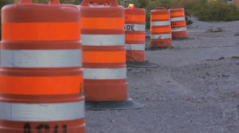 Row of Four Traffic Drums on the Side of the Road Stock Footage 64363832