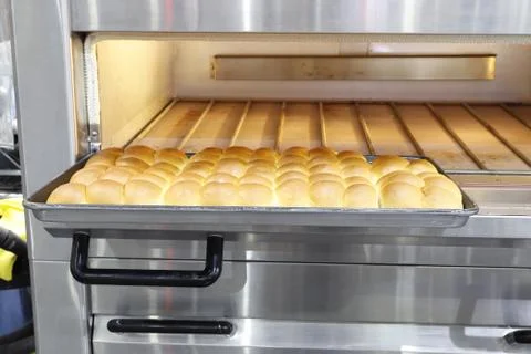 Row of fresh  baking bread from the oven Stock Photos