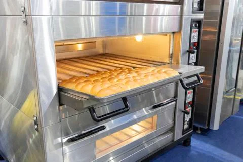 Row of fresh  baking bread from the oven Stock Photos