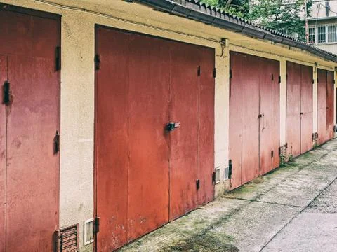 A row of garages with red gates Stock Photos