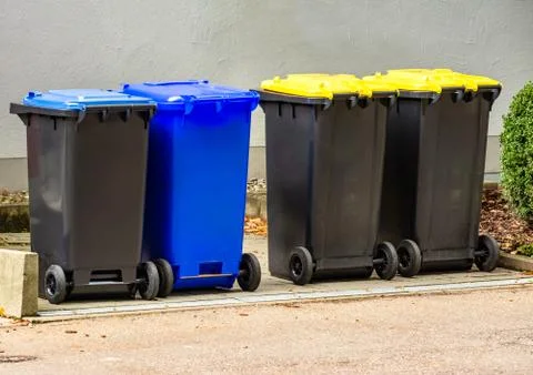 Row of garbage cans Stock Photos
