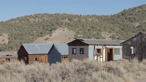 Row of Ghost Town Cabins in the Nevada Desert - Shallow DOF Stock Footage 144733540