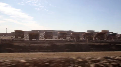Row of giant dumper lorries Stock Footage 48908973