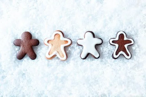 Row of gingerbread men in snow Stock Photos