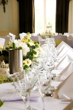 Row of Glasses and table setting on the Top table at a wedding reception Stock Photos
