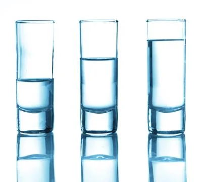A row of glasses for vodka Stock Photos